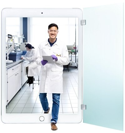 Milli-Q® Services: Quality delivered in person and online Asian man exits a lab by an iPad screen