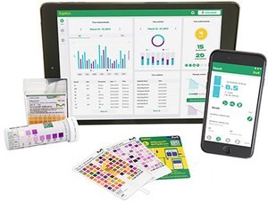 A digital tablet and a smartphone displaying pH measurement and analysis applications, alongside physical pH indicator strips and color charts. 