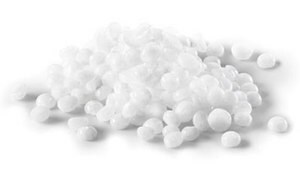 The image displays a pile of white polystyrene foam balls of various sizes on a uniform white background.