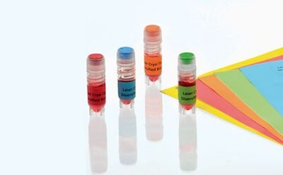 Four small vials with colored caps and labels against a white background. Each vial has a different colored cap: red, orange, blue, and green. 