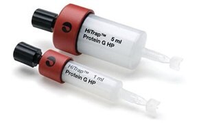 Two HiTrap™ FF columns in different sizes, labeled 1 ml and 5 ml, with black caps and red bases.