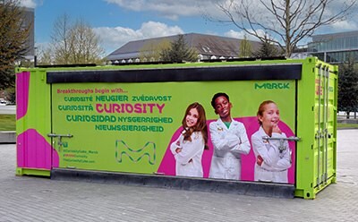 Curiosity Cube, a brightly colored shipping container used for science experiments. Curiosity Cube, a brightly colored shipping container used for science experiments.