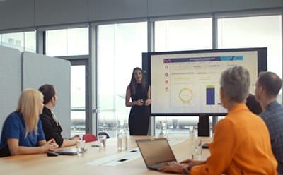 Customer meeting looking at graphs together Customer meeting looking at graphs together