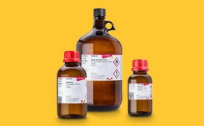 Three Sigma-Aldrich® glas bottles on yellow background.