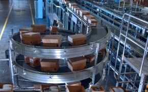 Scientists in production facility performing quality control and testing on production materials and bulk chemicals