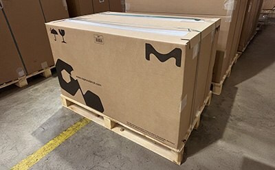 Pallet of shipping boxes with new 100% paper-based edge protectors. Pallet of shipping boxes with new 100% paper-based edge protectors.