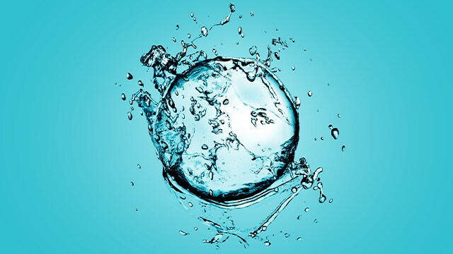 Water drop splash on cyan background